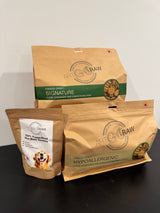 Artisan Raw GO! sampler box with three freeze-dried dog food packages: Signature, Hypoallergenic, and 100% Freeze-Dried.