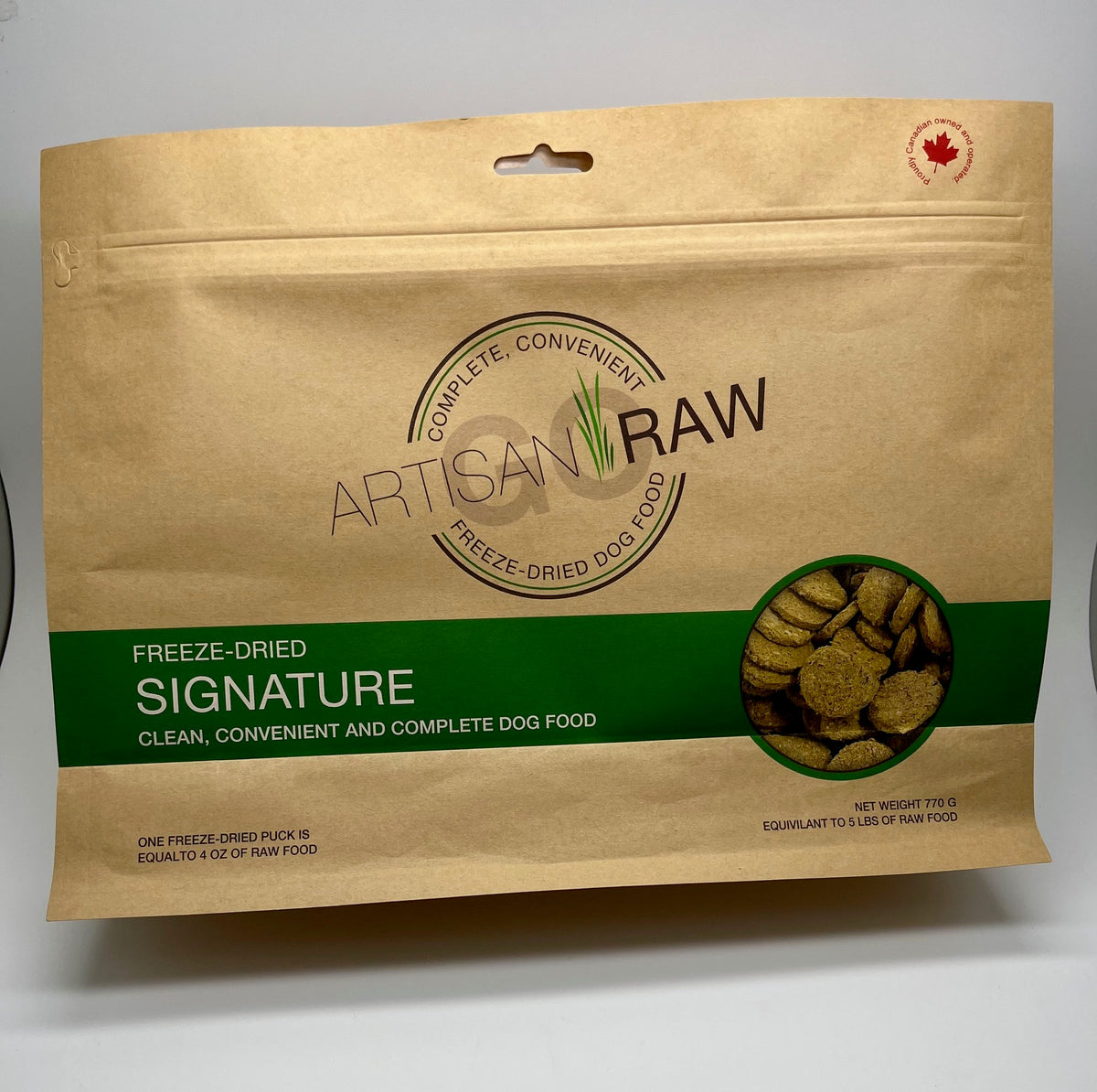 Artisan Raw Signature freeze-dried dog food bag, 770g size, featuring a brown background and green label with dog food pie...