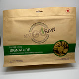 Artisan Raw Signature freeze-dried dog food bag, 770g size, featuring a brown background and green label with dog food pie...