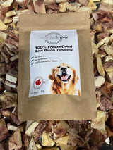 Artisan Raw freeze-dried meal sampler box featuring raw bison tendons with a golden retriever on the packaging.